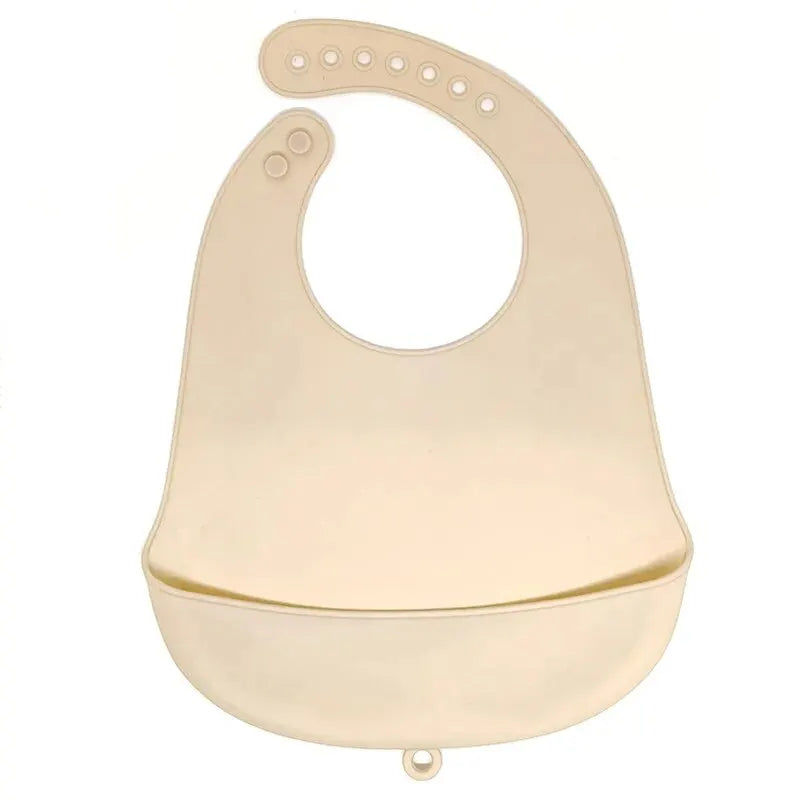 A light beige waterproof silicone baby bib with a catch pocket and multiple loops for fastening.