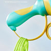 A close-up of a teal and yellow pull-string flying saucer toy launcher with a green string dangling.
