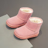 Pink cozy fur-lined winter boots with pink suede material shown on a gray surface.