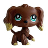 A brown bobblehead toy of a deer with large green glowing eyes.