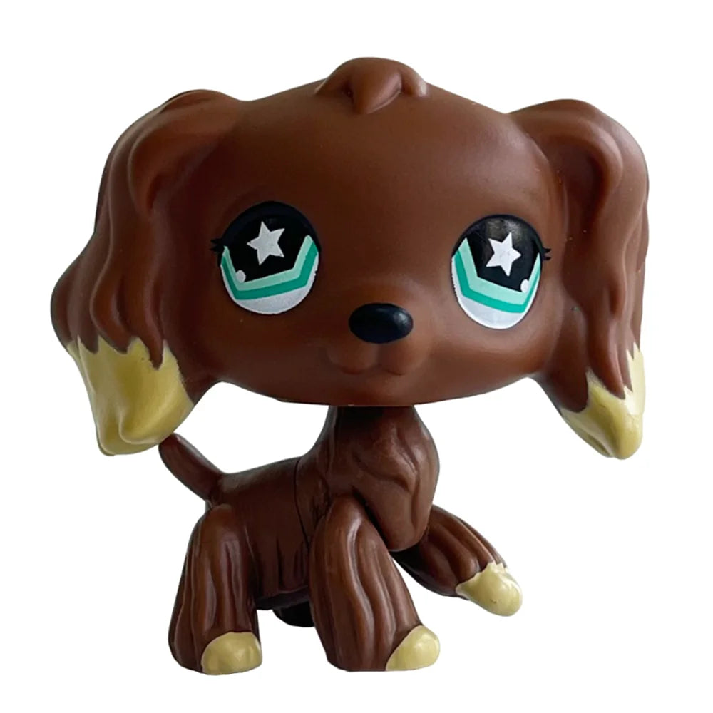 A brown bobblehead toy of a deer with large green glowing eyes.