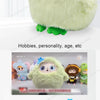 A light green plush robot with large blue eyes sitting on a white surface.