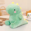 A soft green dinosaur plush toy with yellow spikes sitting on a white table.