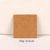 A square brown kraft jewelry display card with two small holes, measuring 5x5 cm.