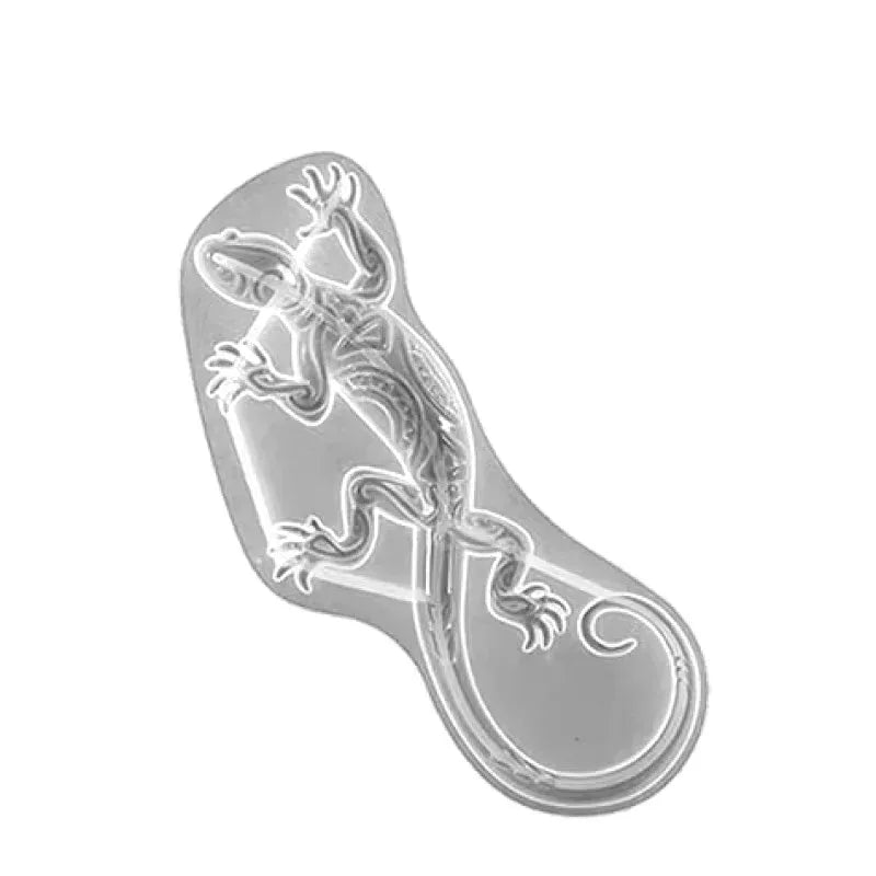 Silicone molds shaped like a gecko and a turtle for resin, soap, and candle making