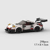 A detailed building block set of a classic rally car featuring white and black components.