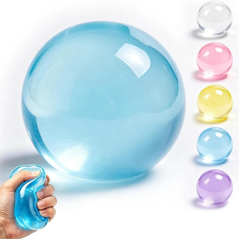 A large, clear blue silicone stress ball is shown next to smaller colored versions and a hand holding a blue squishy.