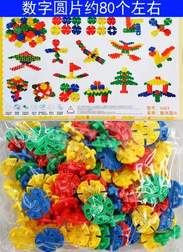A large pile of colorful snowflake building blocks in various colors like red, yellow, blue, and green.