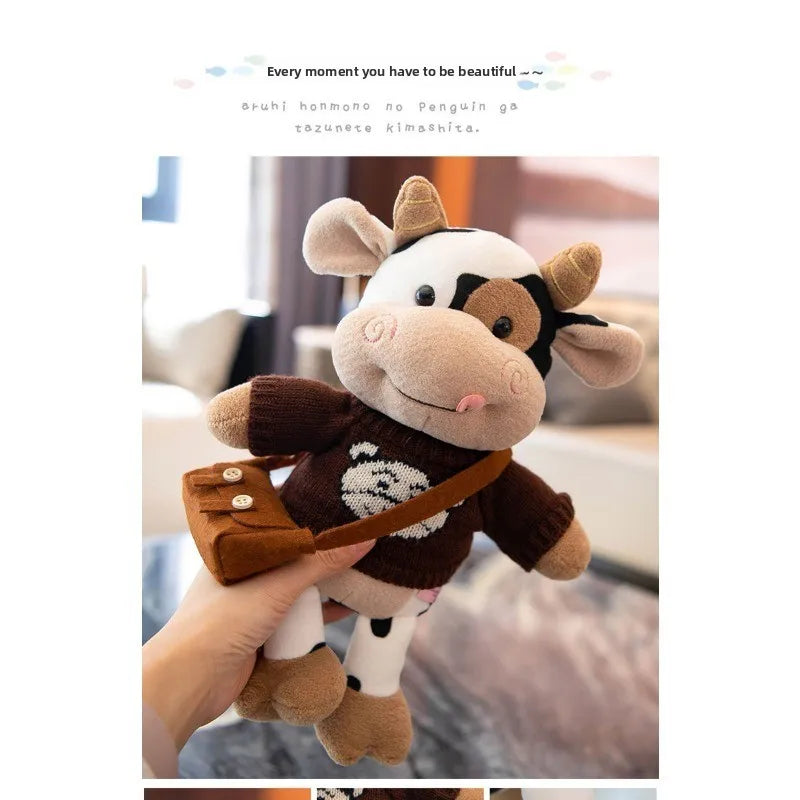 A brown and white cow plush toy with dark brown accents is being held by a person.