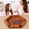 A wooden shut the box dice game set with colored dice and wooden boards shown on a table.