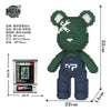 A green bear mini building block set with a white face and dark blue overalls.