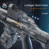 A close-up view of a black water gun replica with a linkage return bore and Z-lock mechanism.