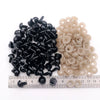 A collection of black and beige plastic safety eyes for amigurumi, including various sizes and locking washers.