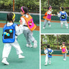 Two children wearing colorful sticky dodgeball vests playing an outdoor game