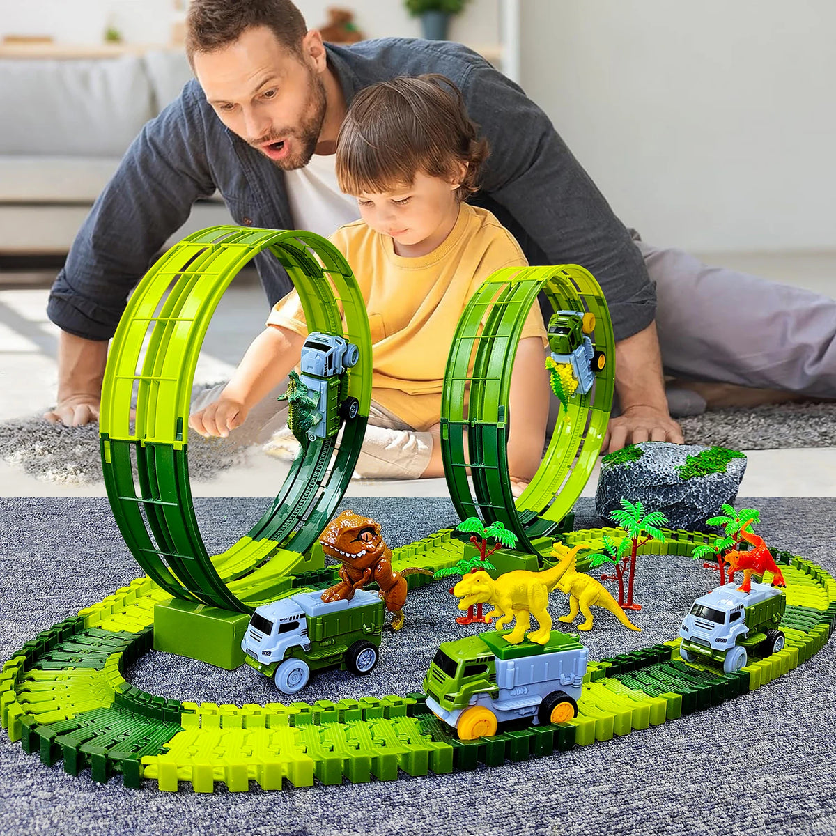 A child and adult build a green glow-in-the-dark LED race car track set for kids on a gray floor.