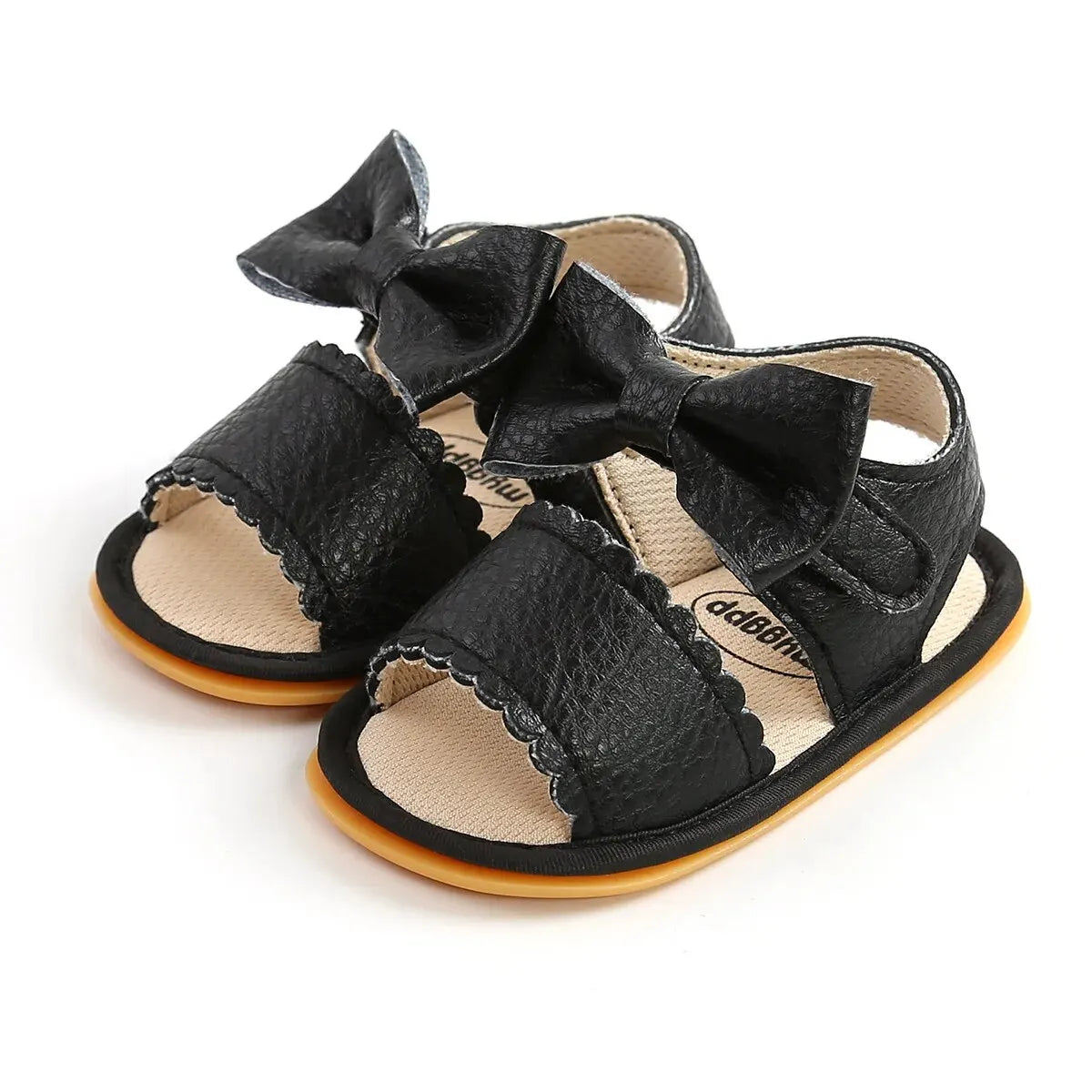 Black faux leather baby summer sandals with a bowknot and soft anti-slip sole