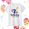 A white kids birthday number t-shirt featuring the text Its my 7th birthday with colorful decorations.