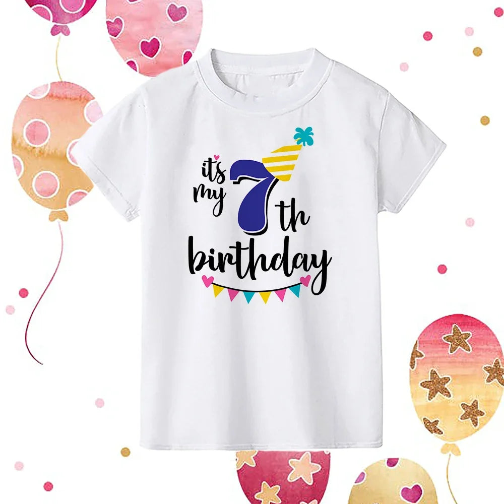 A white kids birthday number t-shirt featuring the text Its my 7th birthday with colorful decorations.