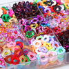 A collection of colorful wave-patterned acrylic beads in various shades and shapes arranged in small compartments.