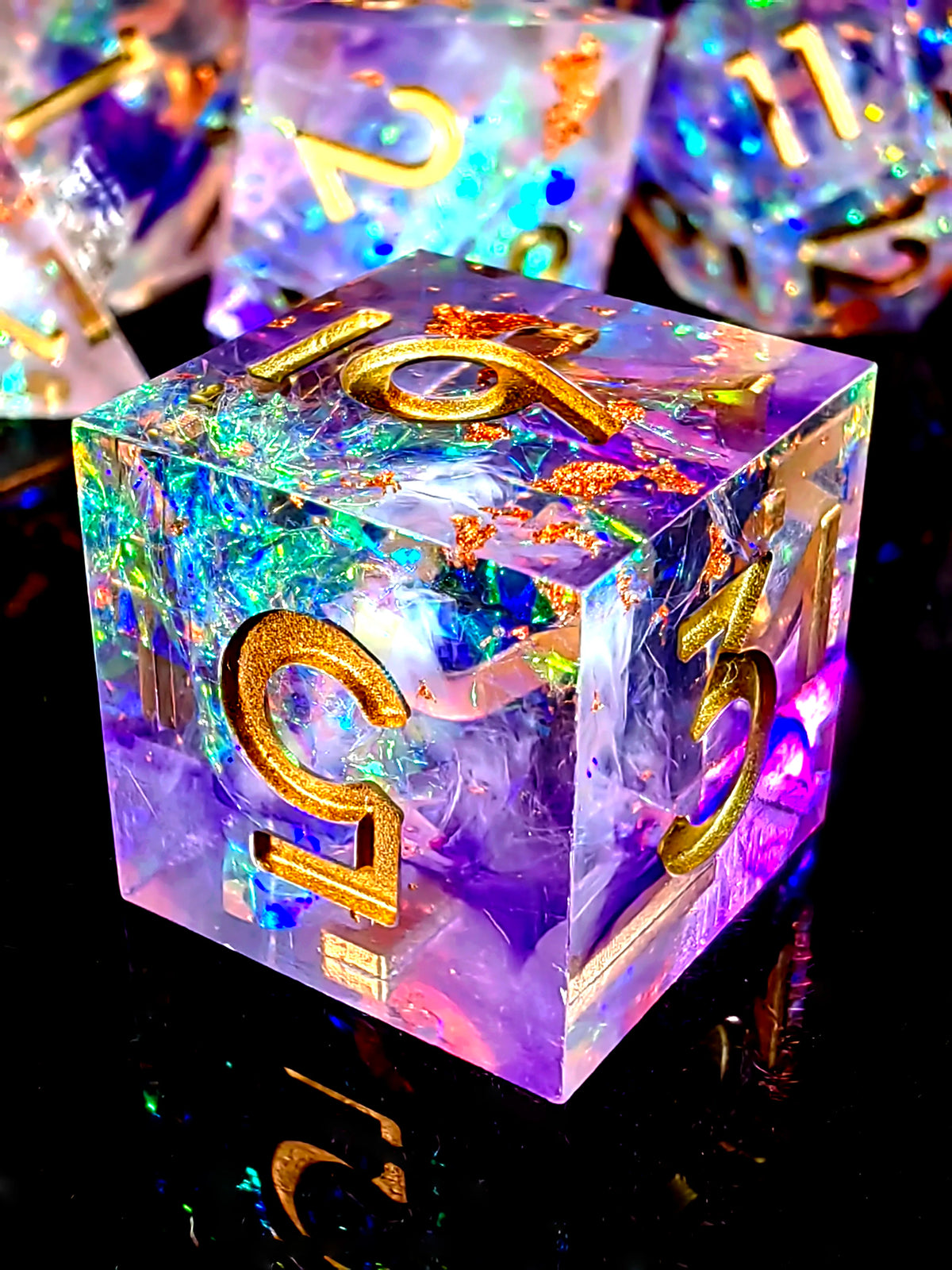 A handcrafted resin polyhedral dice set with light purple and iridescent resin and gold numbers