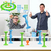 A man is demonstrating a silicone suction cup darts set with various colored darts and targets on a table.