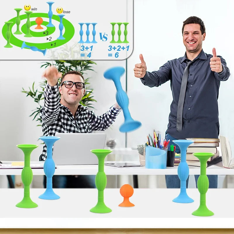 A man is demonstrating a silicone suction cup darts set with various colored darts and targets on a table.