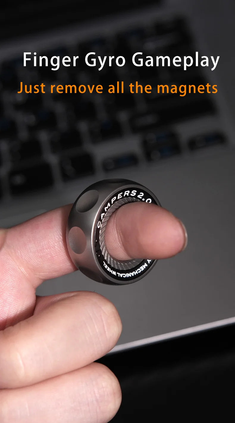 A hand holds a dark gray magnetic fidget ring, demonstrating finger gyro gameplay.
