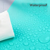 A white rubber block is shown on a turquoise surface covered with water droplets, demonstrating waterproof carving.