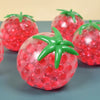 A close-up of a squishy tomato stress relief fidget toy with a glossy red exterior and green stem.