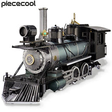 A detailed black and bronze 3D metal steam locomotive model kit with pipes and machinery.