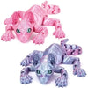 A pink articulated 3D printed Sphynx cat figurine with green eyes.