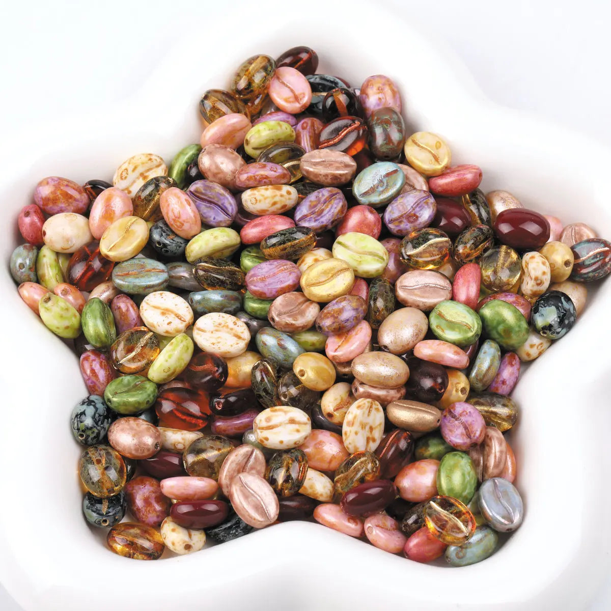 A pile of colorful Czech glass coffee bean beads for jewelry making