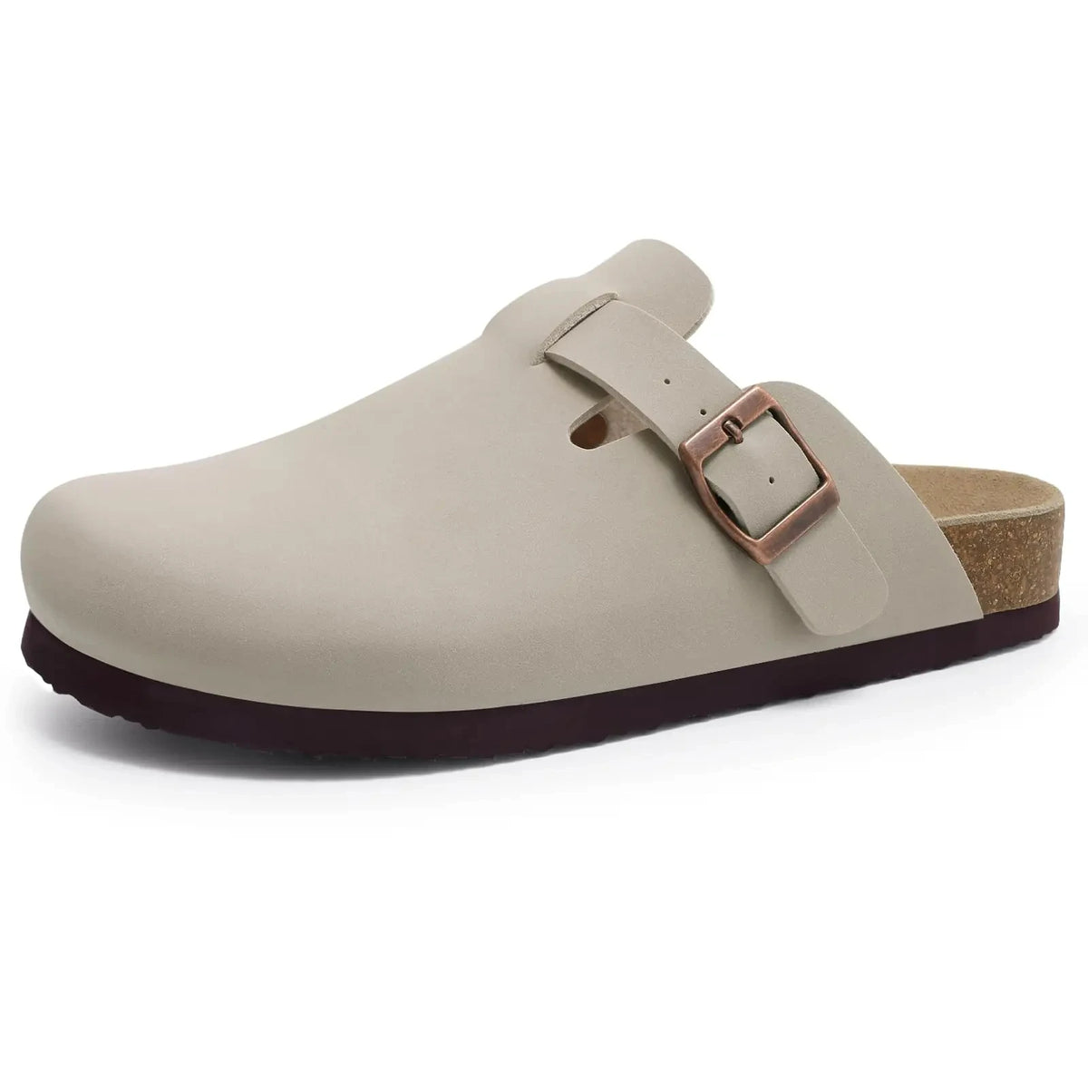 A beige suede cork mule with a leather strap and arch support.