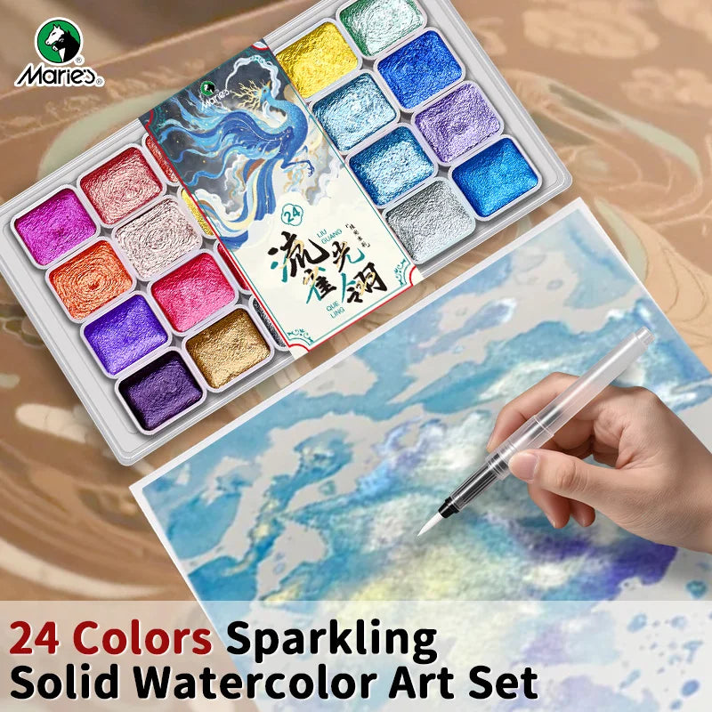 A watercolor paint set featuring 24 sparkling solid colors arranged in a tray, with a hand applying paint to paper.