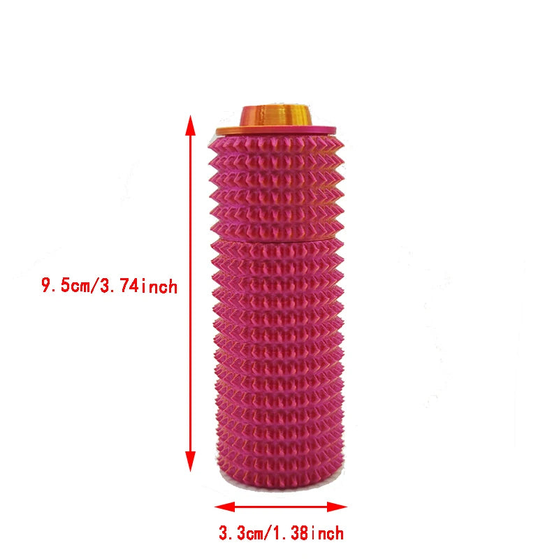 Rouleau sensoriel tactile rose avec cap doré, 9,5 cm de long et 3,3 cm de diamètre.