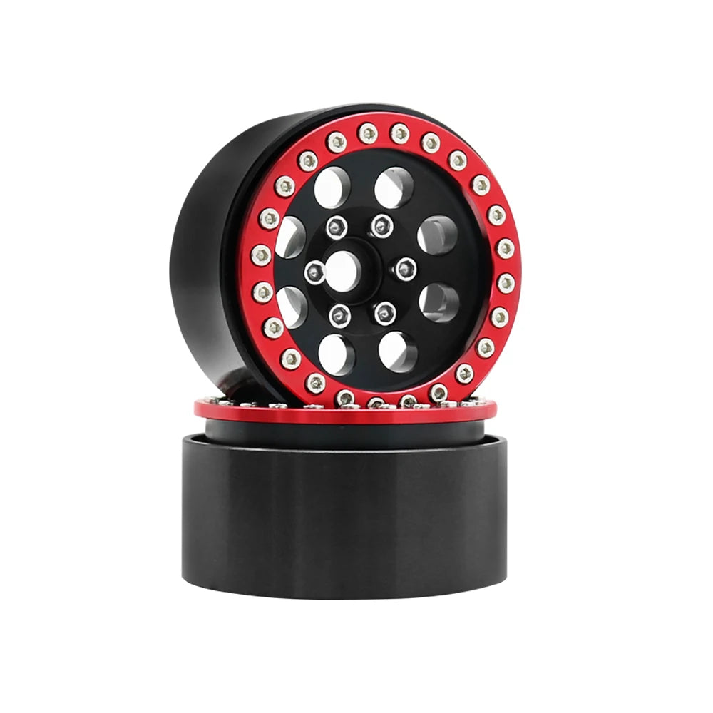 A black beadlock wheel with a red rim and removable hex hub for an RC crawler.