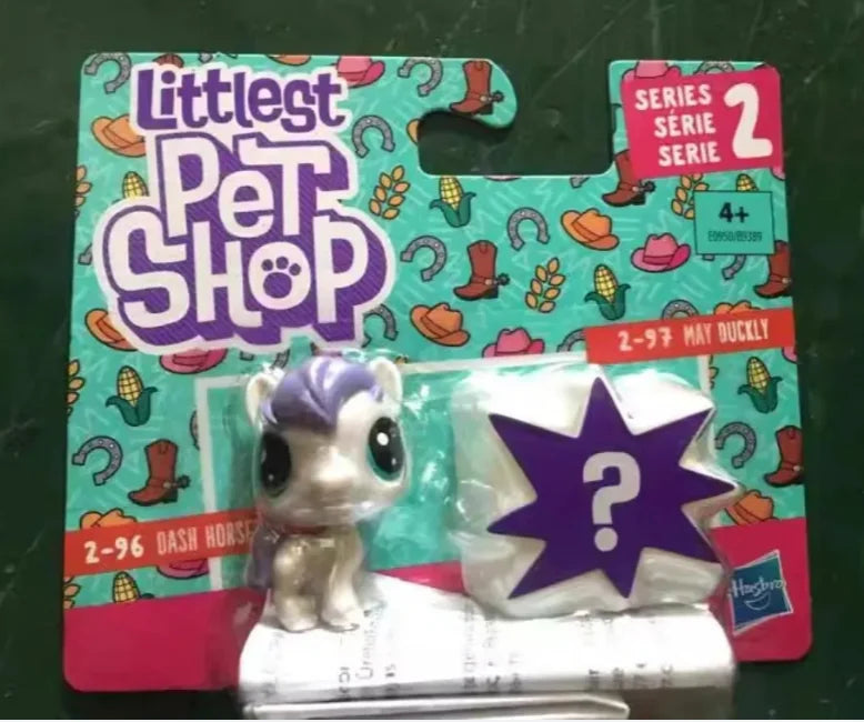 A package of Littlest Pet Shop series 2 figures featuring a purple and white animal character.