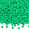 A pile of small, bright green pony beads for jewelry making