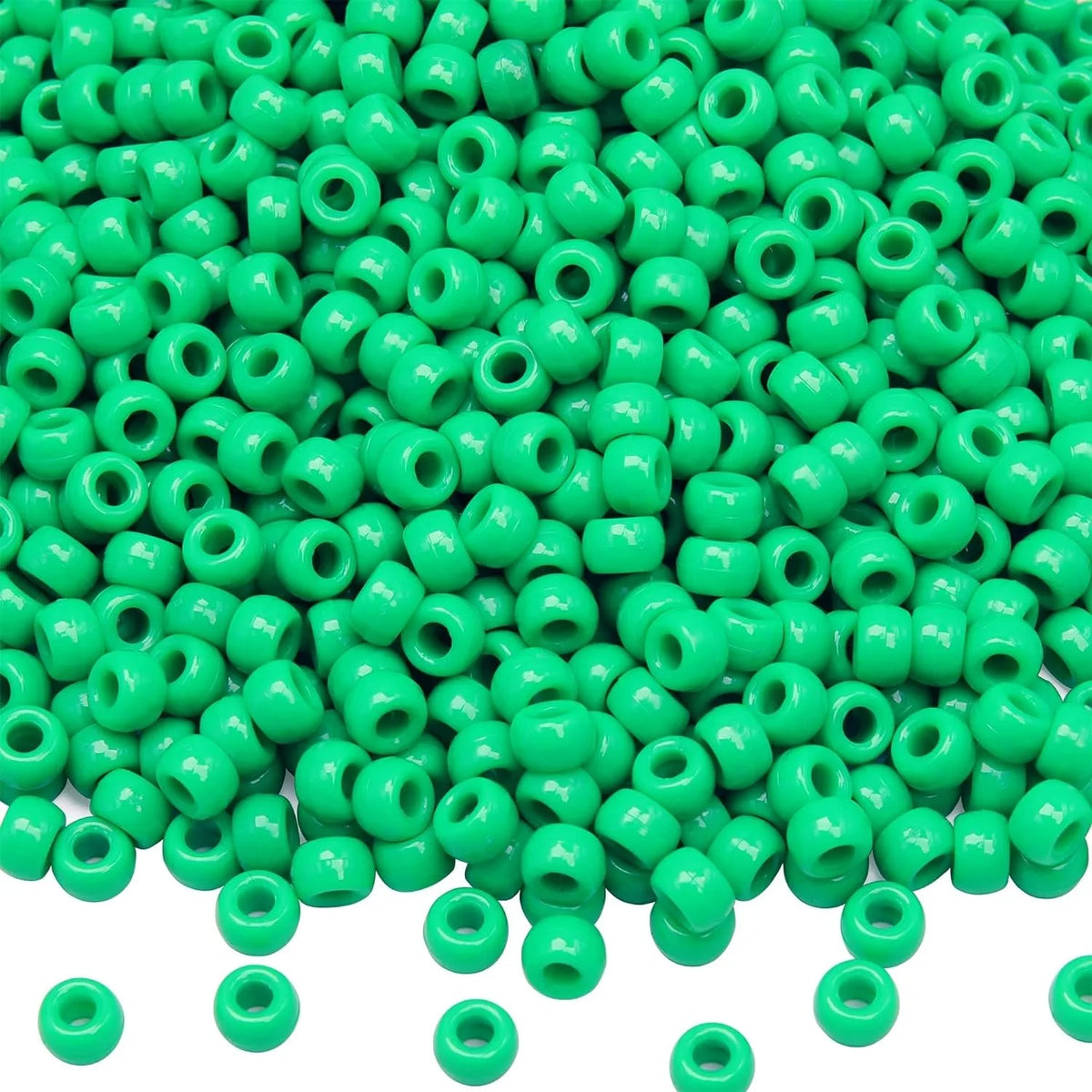 A pile of small, bright green pony beads for jewelry making