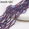 Purple and blue crystal triangle beads strung on a string for jewelry making
