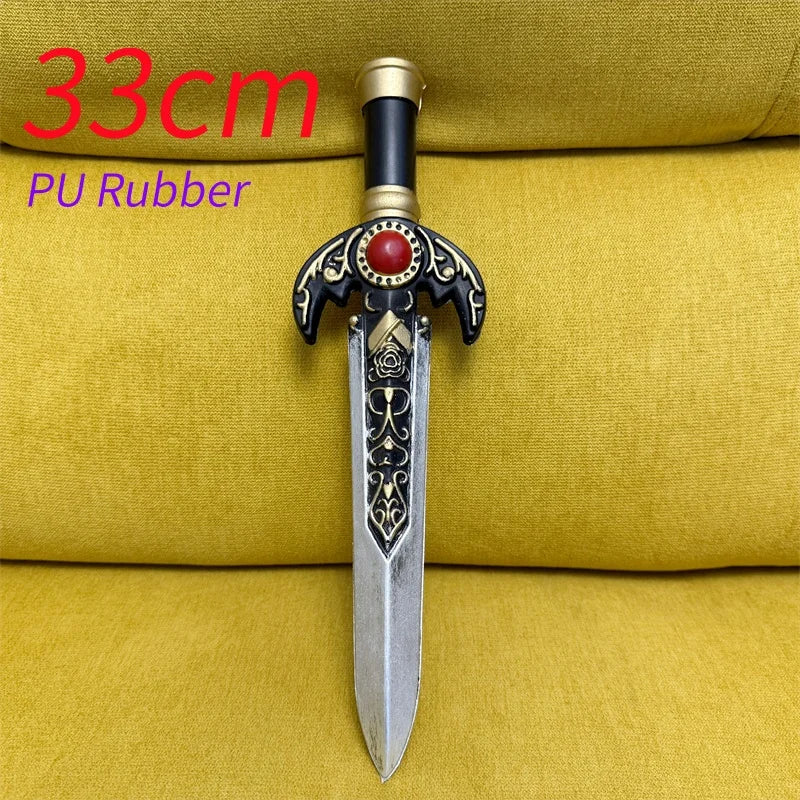 A silver dagger with an ornate black and gold hilt rests on a yellow fabric background.