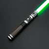 A premium metal lightsaber with a bright green blade and metallic hilt is shown against a dark background.