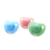 A set of two silicone pacifiers in light blue and pink colors with protective covers