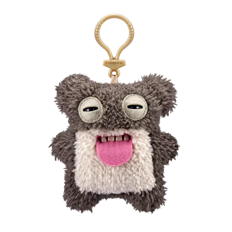 A gray and white plush monster with large eyes and a pink tongue attached to a gold-colored keychain.