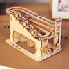 A wooden spiral marble run DIY puzzle kit featuring wooden tracks and marble components.