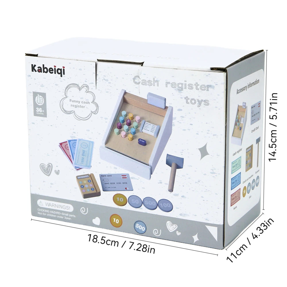 A cardboard box containing a wooden pretend play supermarket checkout counter with a cash register and various toys.