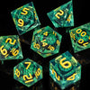 A collection of seven green resin polyhedral dice with yellow markings, set against a dark background.