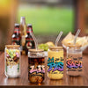 Five glass jars filled with colorful liquid and natural ingredients, featuring Zodiac sign graffiti art stickers.