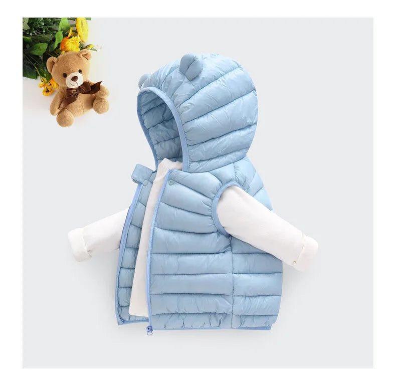 A light blue quilted hooded vest for a child, displayed against a white background.