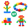 A colorful set of rainbow lacing beads and three strings used for a Montessori threading toy.